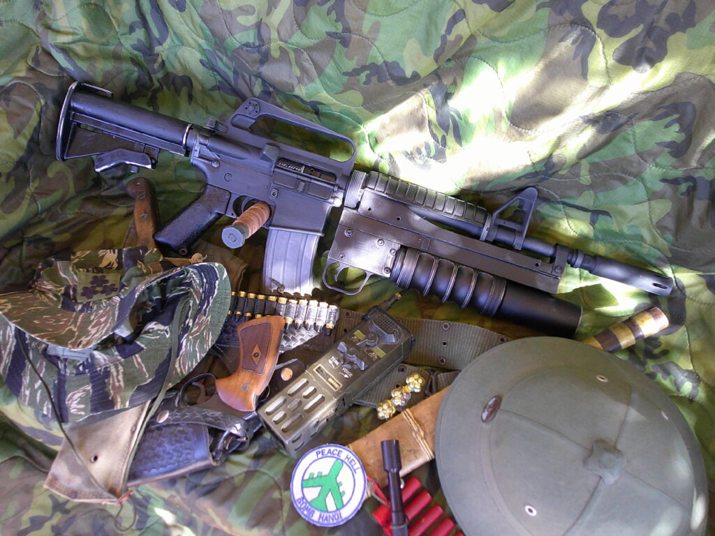 Buy Colt Commando clone XM177-style 5.56 rifle online featuring retro Vietnam-inspired tactical styling, Spikes Havoc launcher, battleworn Cerakote finish, and premium custom rifle upgrades.
