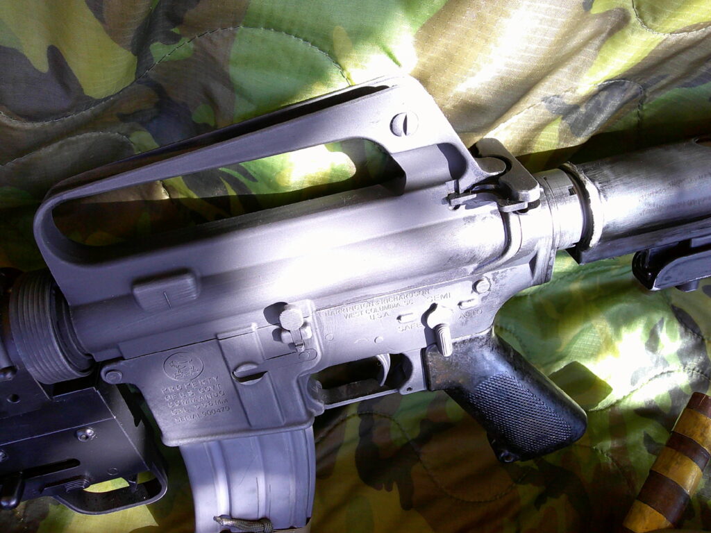 Buy Colt Commando clone XM177-style 5.56 rifle online featuring retro Vietnam-inspired tactical styling, Spikes Havoc launcher, battleworn Cerakote finish, and premium custom rifle upgrades.